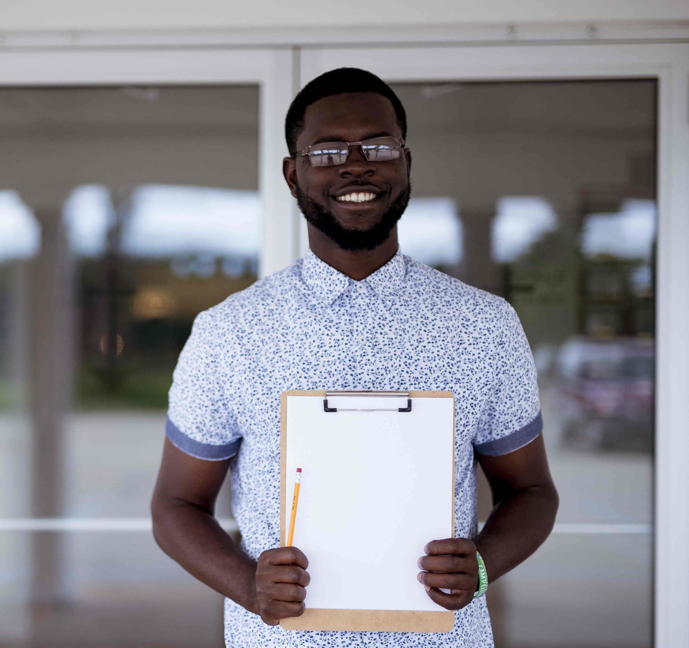 man-holding-clipboard-smiling2